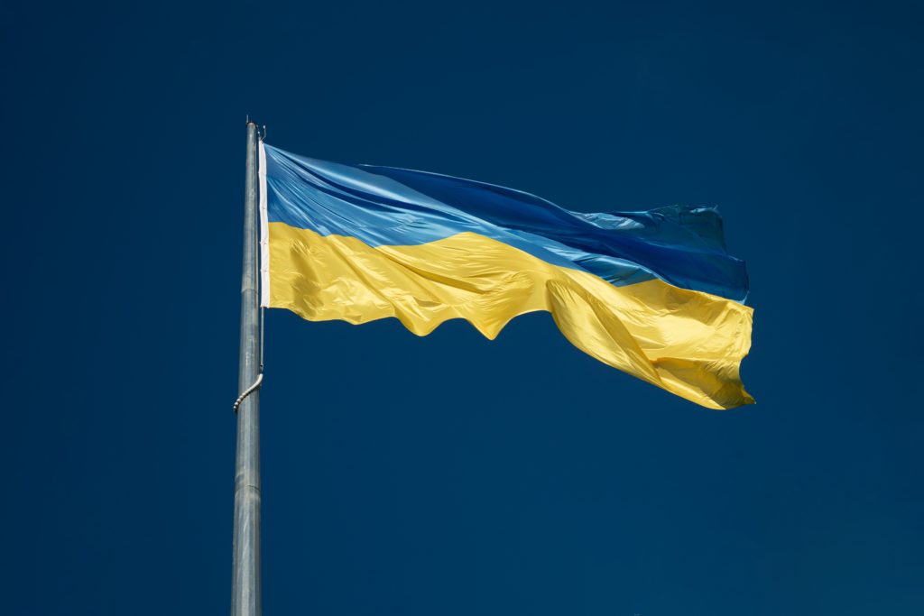 Ukrainian Flag from below against a blue sky